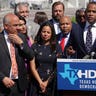 Flanked by Texas state House Democrats, U.S. Rep. Marc Veasey (D-TX) (C) speaks as Rep. Lloyd Doggett (D-TX) (R) and Texas State Rep. Chris Turner (D-District 101) (L), chair of the Texas House Democratic Caucus, listening during a news conference on voting rights July 13.