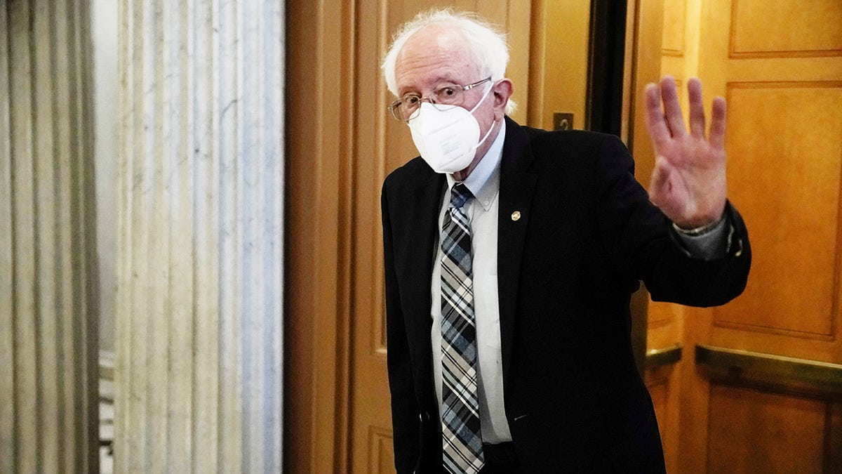 Sen. Bernie Sanders, I-Vt., walks to the Senate floor at the U.S. Capitol in Washington, Aug. 7, 2021. 