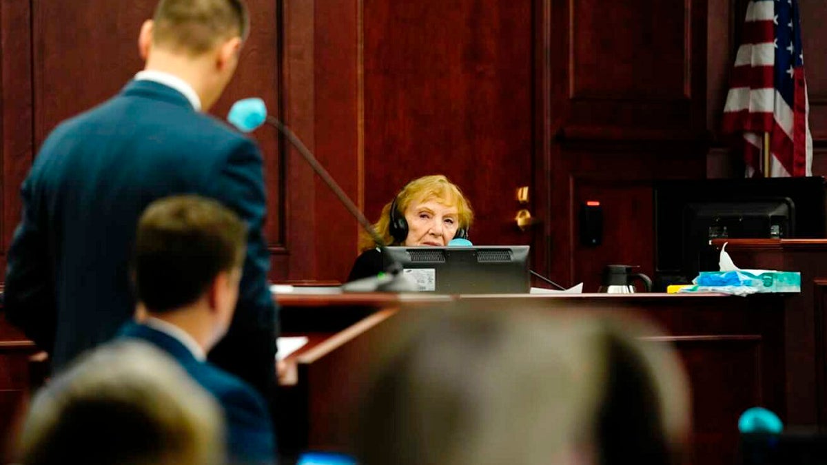 Constance Bennett, the mother of murder victim Bruce Bennett, is questioned by District Attorney John Kellner during Alex Ewing's murder trial. (Philip B. Poston/Sentinel Colorado via AP, Pool)