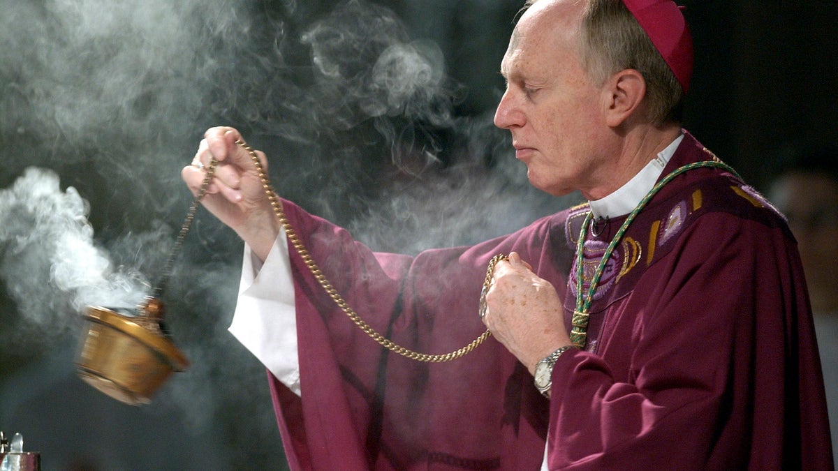 A Bishop swings incense during an Ash Wednesday communion