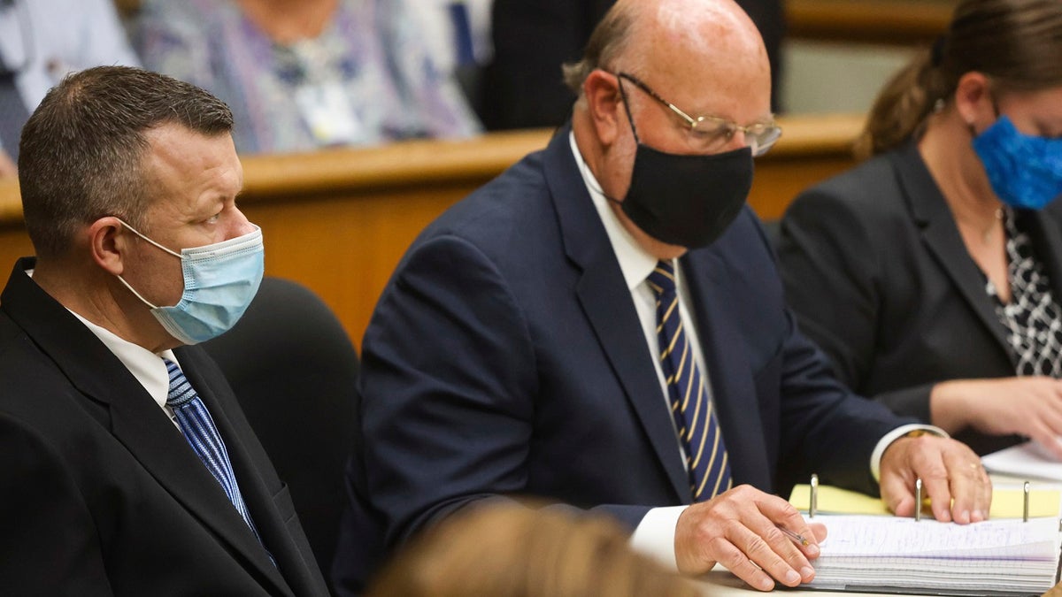 Paul Flores, left, appears at his arraignment, with attorneys Robert Sanger, center, and Sara Sanger, right