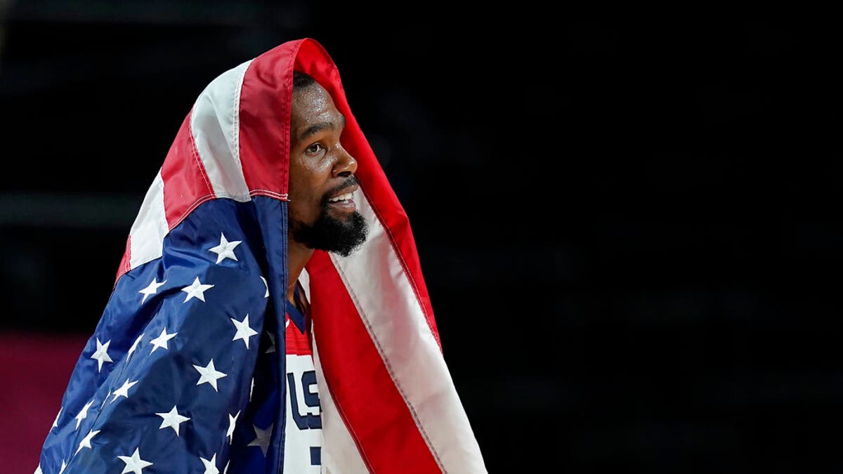 United States' Kevin Durant (7) celebrates after their win in the men's basketball gold medal game against France at the 2020 Summer Olympics, Saturday, Aug. 7, 2021, in Saitama, Japan. (AP Photo/Charlie Neibergall)