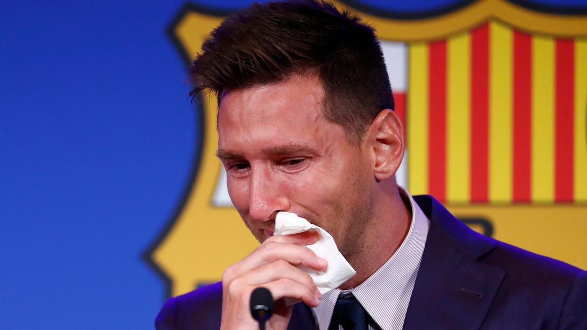 In this Sunday, Aug. 8, 2021, file photo, Lionel Messi cries at the start of a press conference at the Camp Nou stadium in Barcelona, Spain. (AP Photo/Joan Monfort, file)