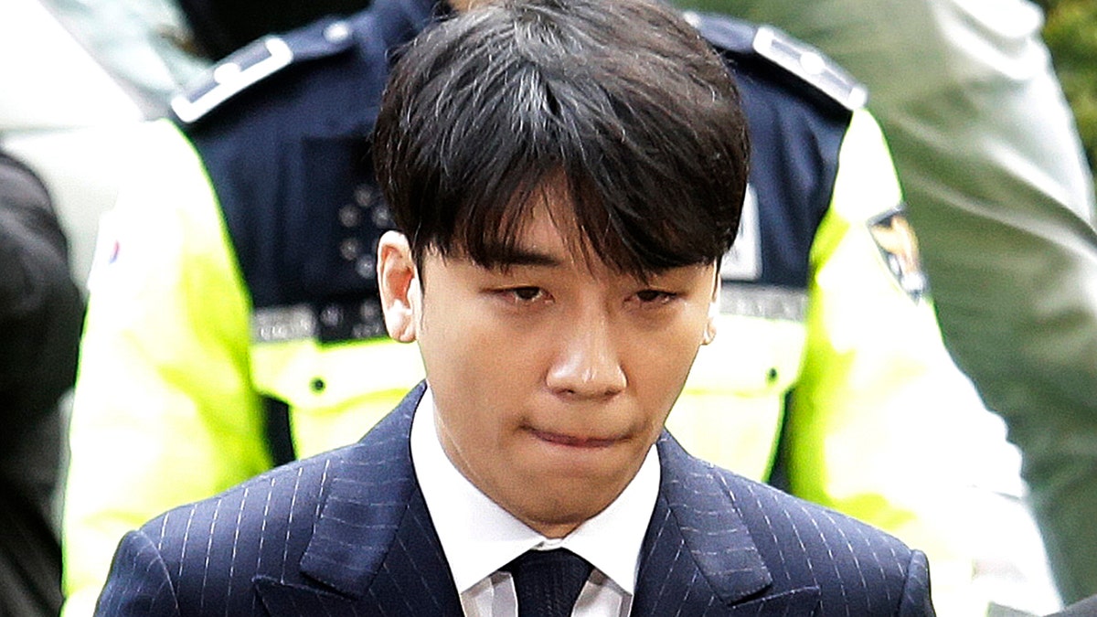 Seungri, a former member of a popular K-pop boy band Big Bang, arrives at the Seoul Metropolitan Police Agency in Seoul, South Korea, in March 2019.
