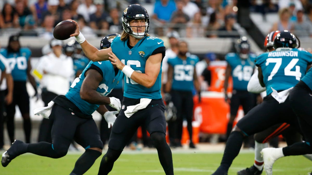 Jacksonville Jaguars quarterback Trevor Lawrence throws a pass during the first half of an NFL preseason football game against the Cleveland Browns, Saturday, Aug. 14, 2021, in Jacksonville, Fla. (AP Photo/Stephen B. Morton)
