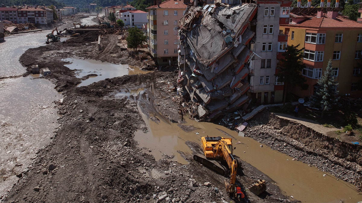 An aerial view of the city center in Bozkurt town of Kastamonu province, Turkey, Sunday, Aug. 15, 2021, damaged after flooding. Turkey sent ships to help evacuate people and vehicles from a northern town on the Black Sea that was hard hit by flooding, as the death toll in the disaster rose Sunday to at least 62 and more people than that remained missing. (AP Photo)