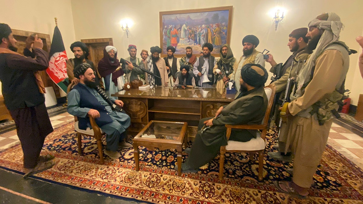 Taliban fighters take control of Afghan presidential palace after the Afghan President Ashraf Ghani fled the country, in Kabul, Afghanistan, Sunday, Aug. 15, 2021.?