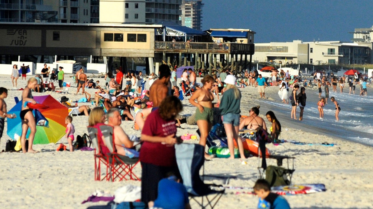 Beachgoers are shown on the coast at Gulf Shores, Alabama, on Thursday, Aug. 12, 2021. (Associated Press)