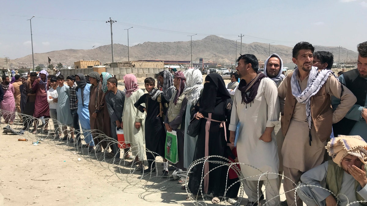 Afghans gather at Kabul airport