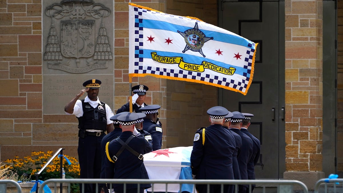 The body of slain Chicago police officer Ella French is carried into the St. Rita of Cascia Shrine Chapel Wednesday, Aug. 18, 2021, for a wake. French was killed and her partner was seriously wounded during an Aug. 7  traffic stop on the city's South Side.  