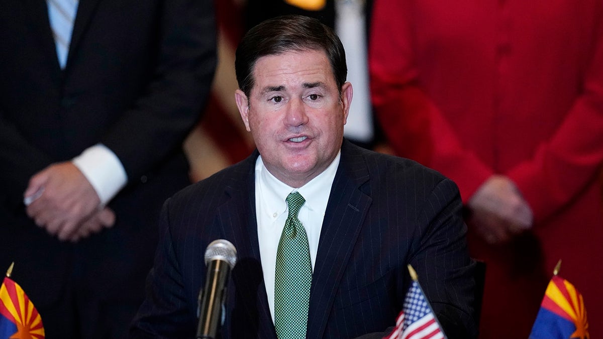 FILE - In this April 15, 2021, file photo, Arizona Republican Gov. Doug Ducey speaks during a bill signing in Phoenix. The Arizona Supreme Court is set to release its decision, Thursday, Aug. 19, 2021, in a constitutional challenge to a new tax on high earners that was designed to increase school funding and approved by the state’s voters in November. Ducey opposed the new tax and said he hopes the state's high court finds it unconstitutional. (AP Photo/Ross D. Franklin, File)