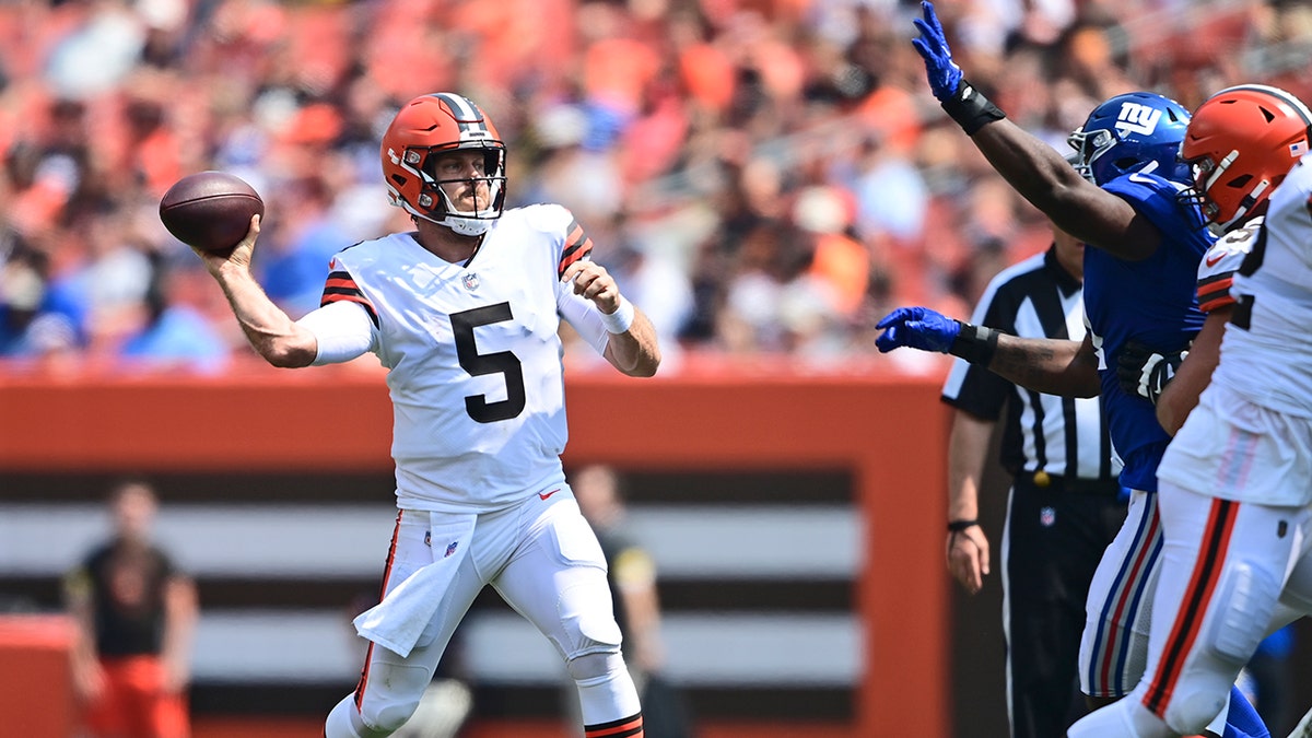 Cleveland Browns quarterback Case Keenum throws during the first half of an NFL football game against the New York Giants, Sunday, Aug. 22, 2021, in Cleveland. (AP Photo/David Dermer)