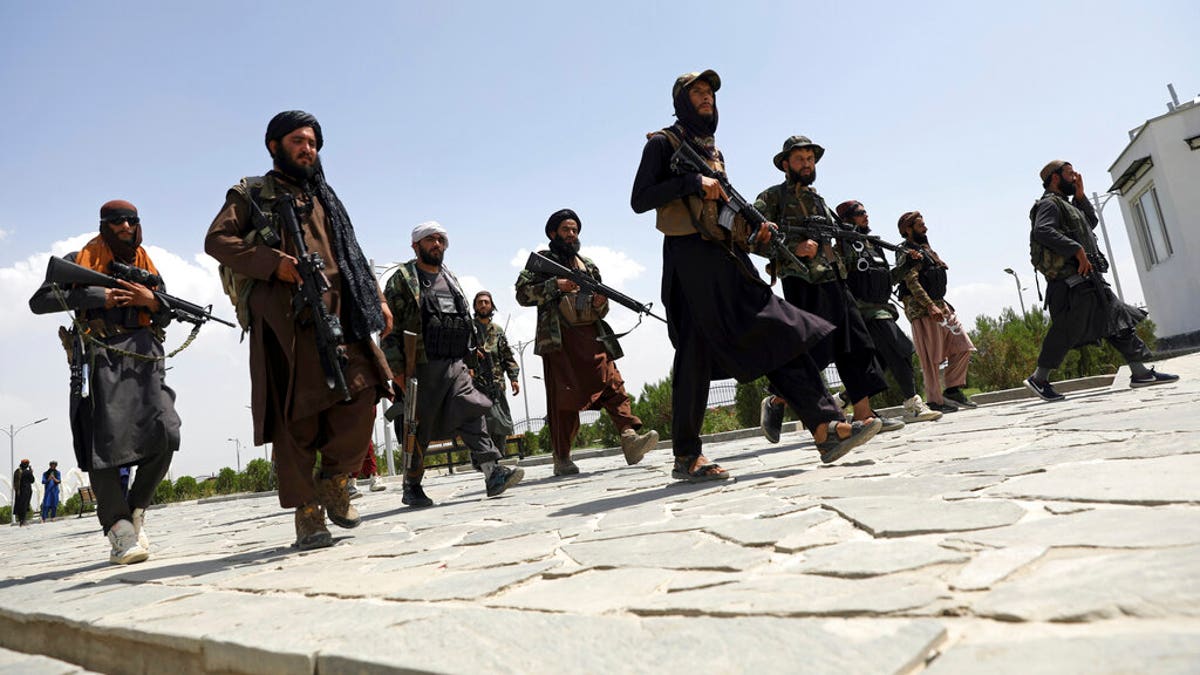 Taliban fighters patrol in Kabul