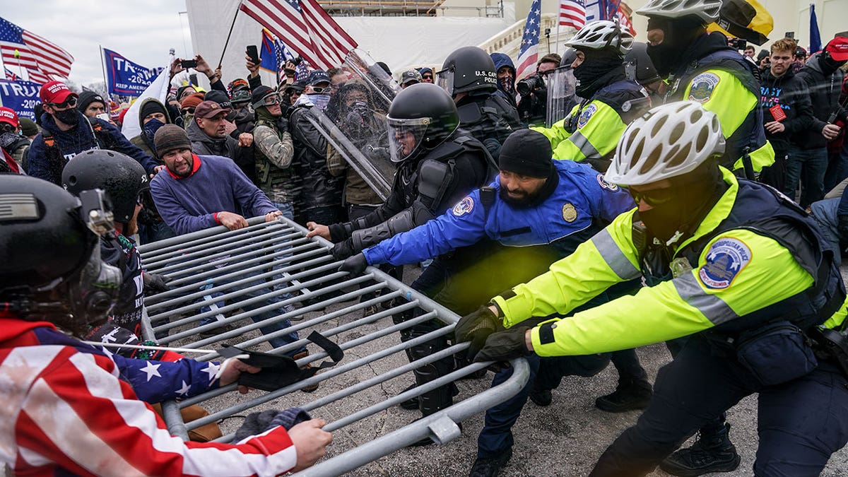 In this Jan. 6, 2021, file photo crowds try to break through a police barrier at the U.S. Capitol in Washington, D.C. An inspector general's report says U.S. Capitol Police did not properly respond to officers’ use of an emergency notification system on Jan. 6, and there are no records that most calls were simulcast over the radio or that a watch commander was even aware of at least some of them. That's according to a report obtained by The Associated Press.
