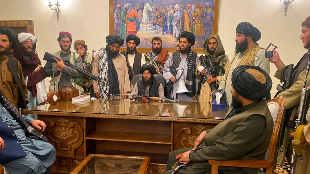 FILE - In this Aug. 15, 2021 file photo, Taliban fighters take control of Afghan presidential palace in Kabul, Afghanistan, after President Ashraf Ghani fled the country. (AP Photo/Zabi Karimi, File)