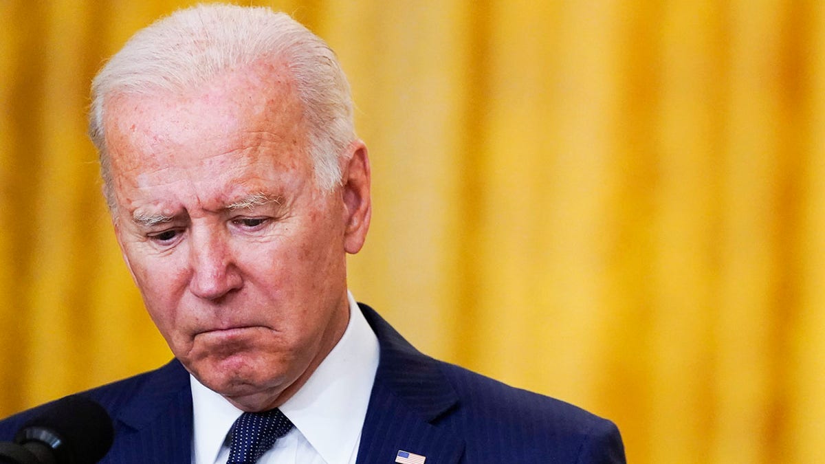 President Joe Biden pauses as he speaks about the bombings at the Kabul airport that killed at least 12 U.S. service members, from the East Room of the White House, Thursday, Aug. 26, 2021, in Washington. (AP Photo/Evan Vucci)