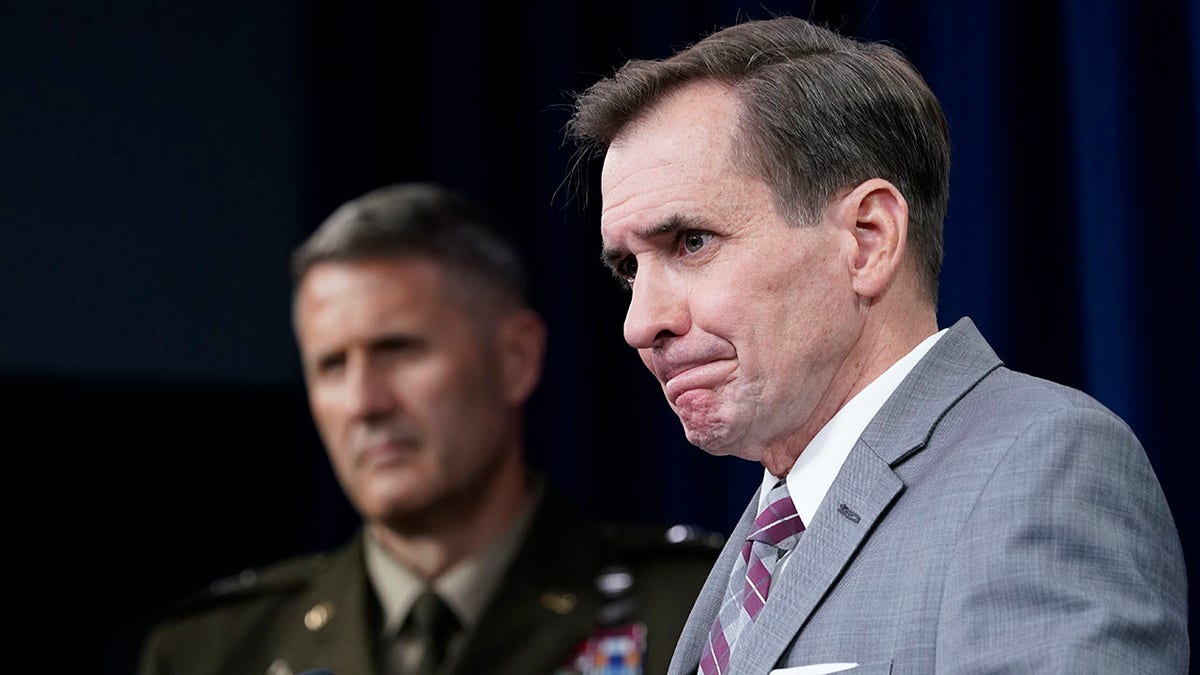 Pentagon spokesman John Kirby, right, and Army Maj. Gen. William "Hank" Taylor, left, listen to questions during a briefing at the Pentagon in Washington, Saturday, Aug. 28, 2021.