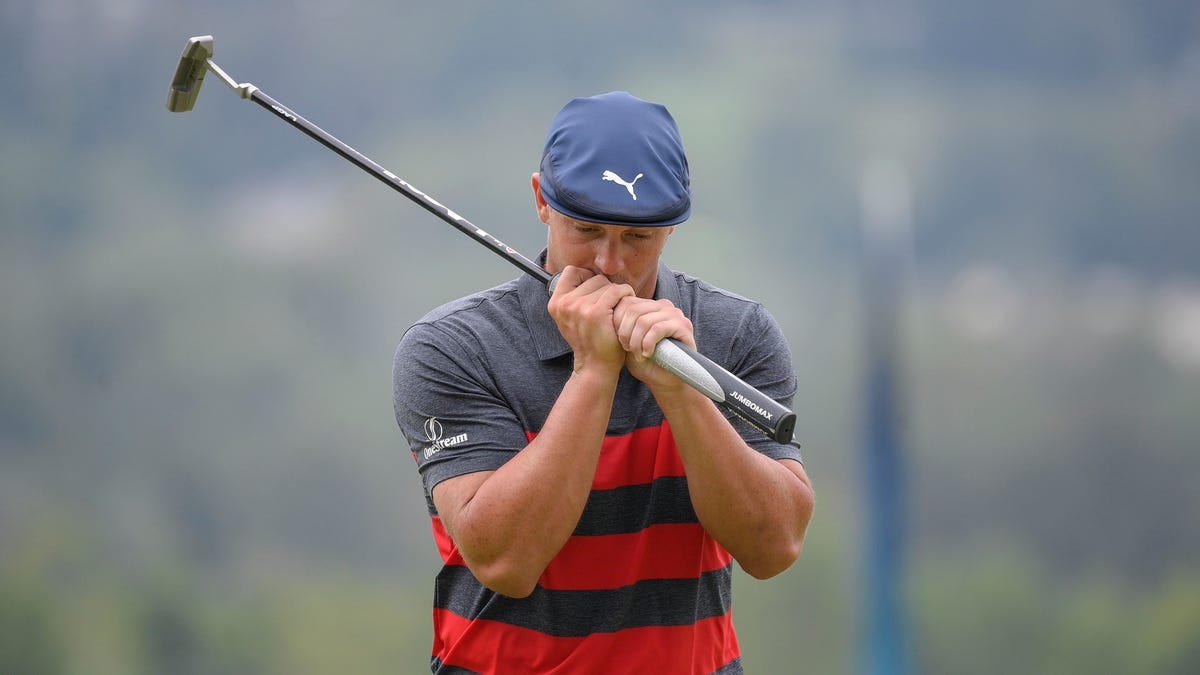Bryson DeChambeau reacts after missing a putt on the ninth green during the final round of the BMW Championship golf tournament, Sunday, Aug. 29, 2021, at Caves Valley Golf Club in Owings Mills, Md. (AP Photo/Nick Wass)