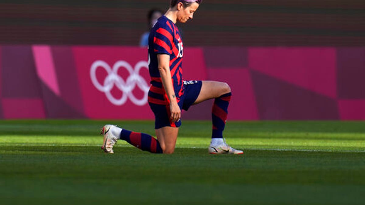 United States' Megan Rapinoe kneels prior to the women's bronze medal soccer match against Australia at the 2020 Summer Olympics, Thursday, Aug. 5, 2021, in Kashima, Japan. (AP Photo/Fernando Vergara)