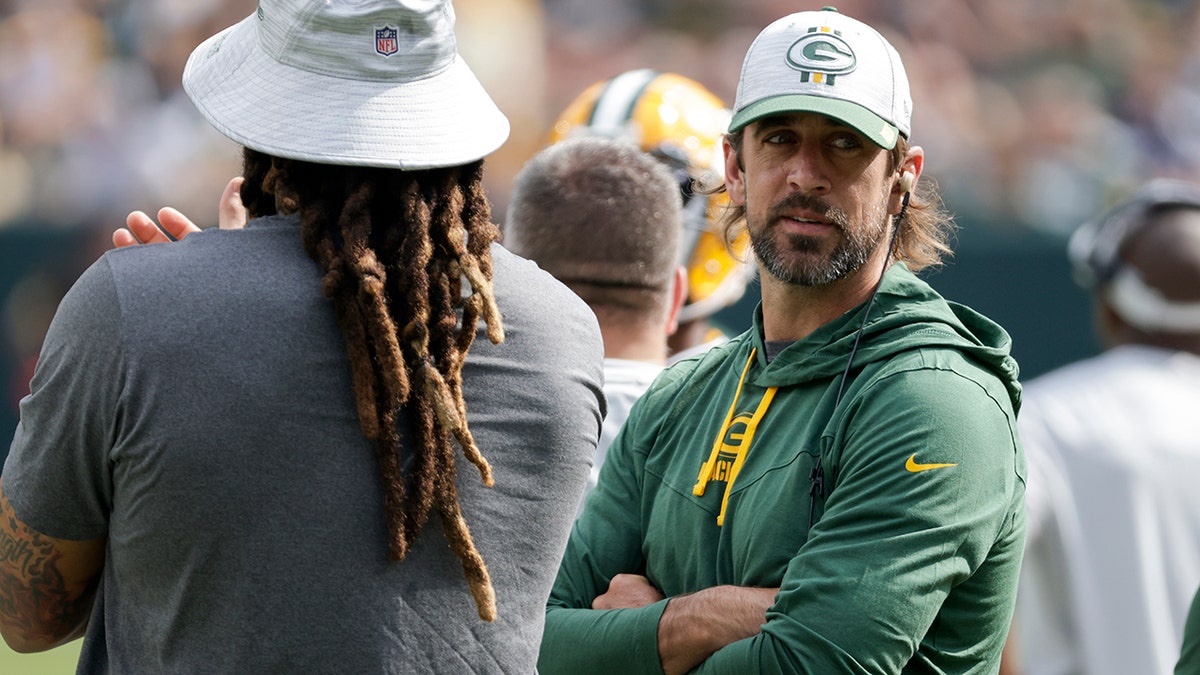 Green Bay Packers' Aaron Rodgers watches from the sidelines during the first half of a preseason NFL football game against the New York Jets Saturday, Aug. 21, 2021, in Green Bay, Wis.