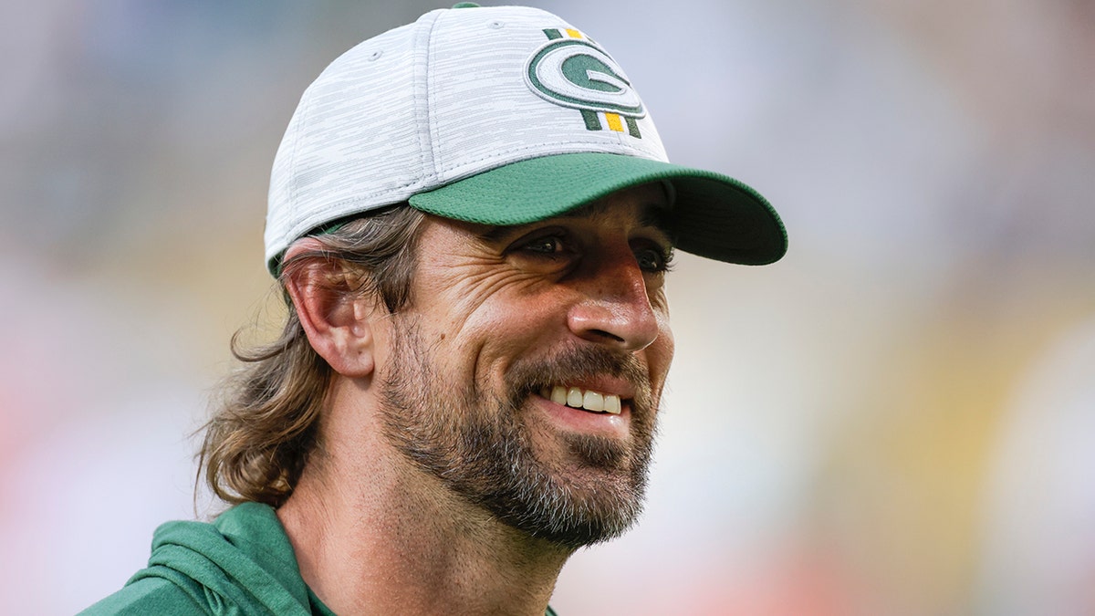 Green Bay Packers' Aaron Rodgers smiles after a preseason NFL football game against the New York Jets Saturday, Aug. 21, 2021, in Green Bay, Wis. The Jets won 23-14. 