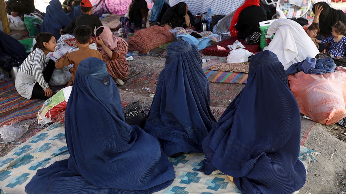 Internally displaced Afghans from northern provinces, who fled their home due to fighting between the Taliban and Afghan security personnel, take refuge in a public park in Kabul, Afghanistan, Friday, Aug. 13, 2021.