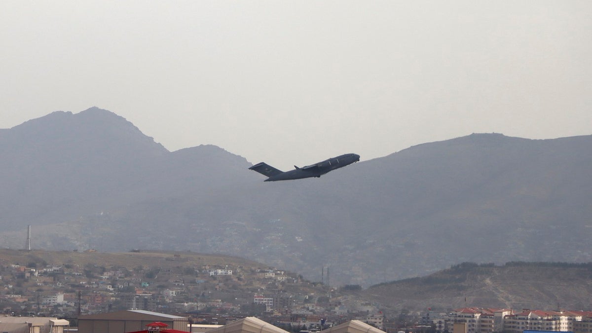 A U.S military aircraft takes off from the Hamid Karzai International Airport in Kabul, Afghanistan, on Monday.