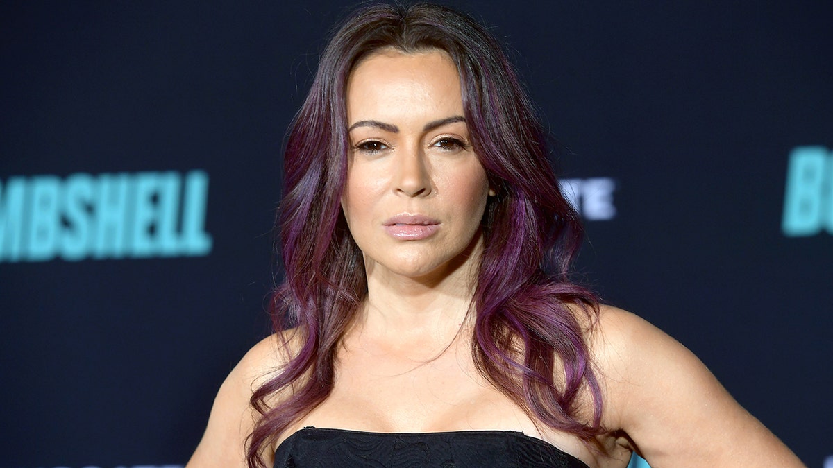 Alyssa Milano poses on the red carpet