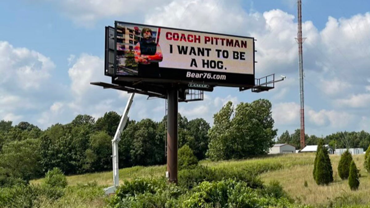 The billboard, which McWhorter put up on I-49, says: "Coach Pittman, I want to be a Hog."
