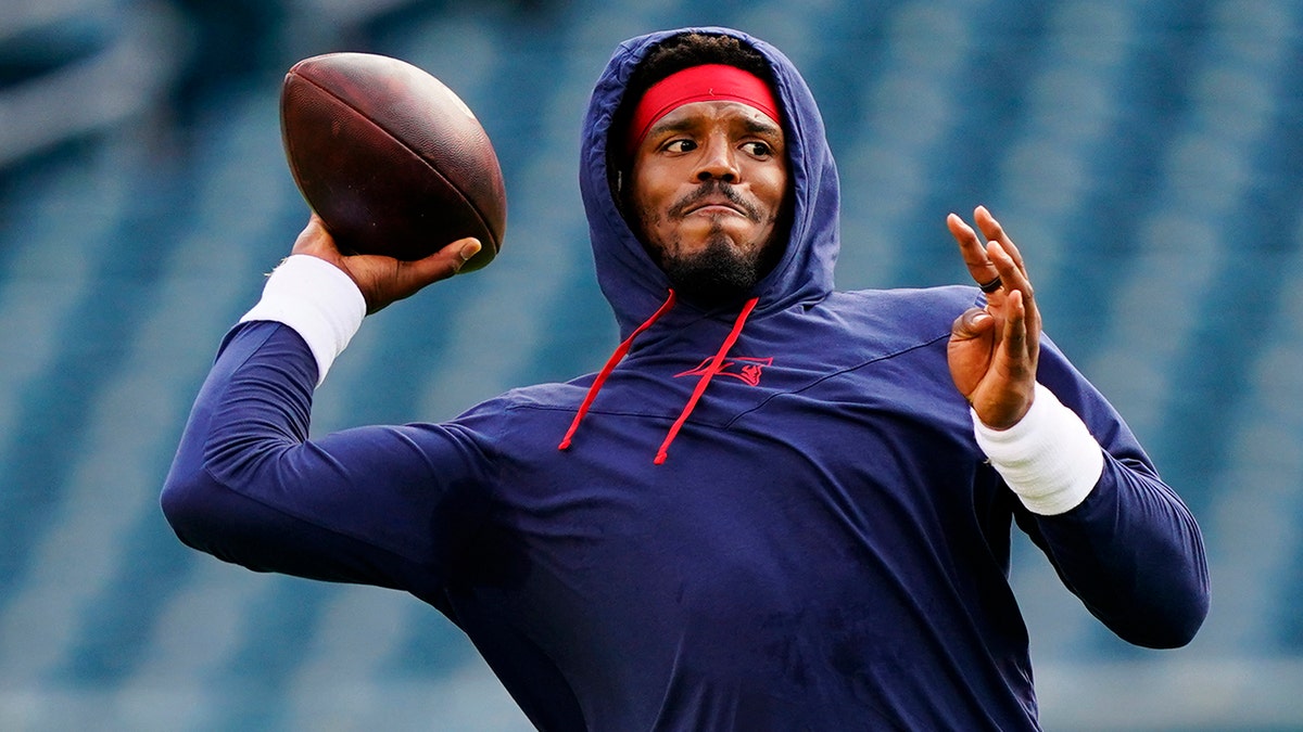 New England Patriots' Cam Newton warms up before a preseason NFL football game Philadelphia Eagles on Thursday, Aug. 19, 2021, in Philadelphia. (AP Photo/Matt Rourke)