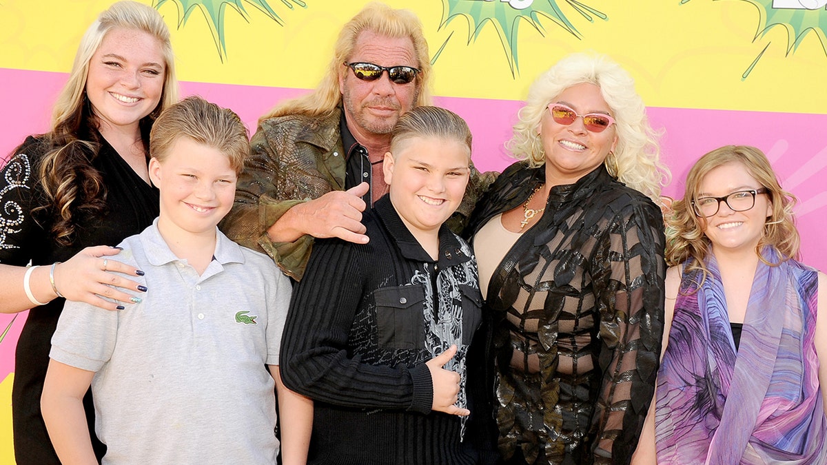 Cicily Chapman, left, and sister Bonnie, right, say their dad, Duane 'Dog' Chapman, center, didn't invite them to his wedding to his new wife. Their mother, Beth Chapman, second from right, died of throat cancer in 2019. 