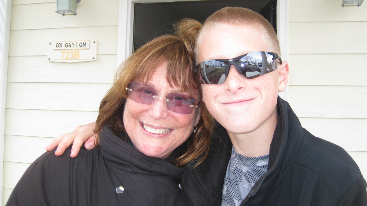 Judy Rogg and her late son Erik Robinson, 12, are pictured in March 2010. 