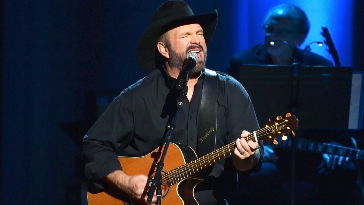 Garth Brooks performing on stage