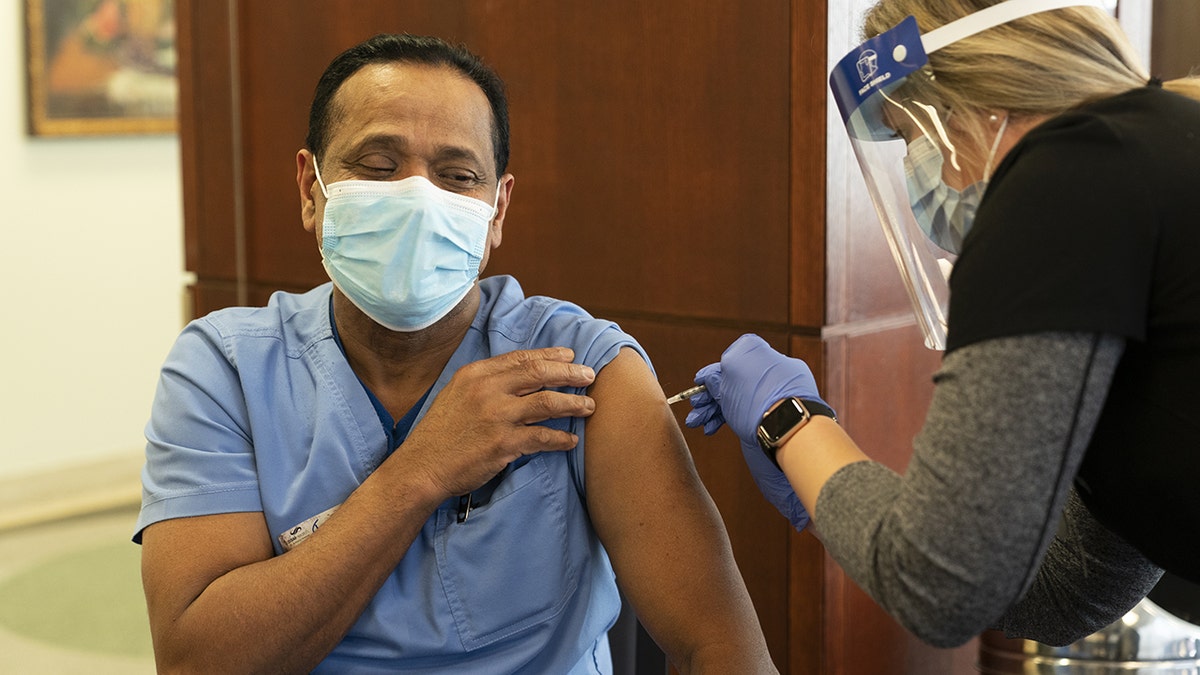 A healthcare worker receives the Pfizer-BioNTech Covid-19 vaccine at SSM Health St. Anthony Hospital in Oklahoma City, Oklahoma, Dec. 16, 2020. (Getty Images)