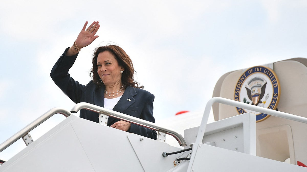 Vice President Kamala Harris makes her way to board a plane before departing from Andrews Air Force Base in Maryland on June 14, 2021. 