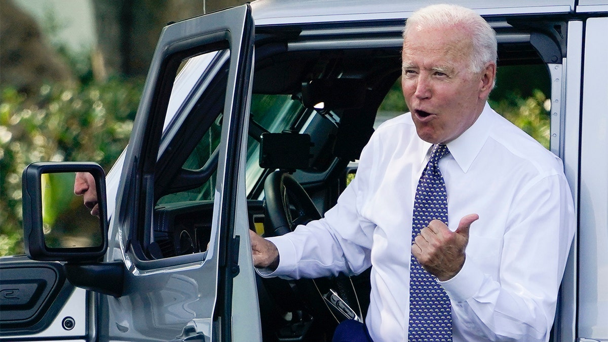 Biden touts electric vehicle tax credits with picture of him in luxury