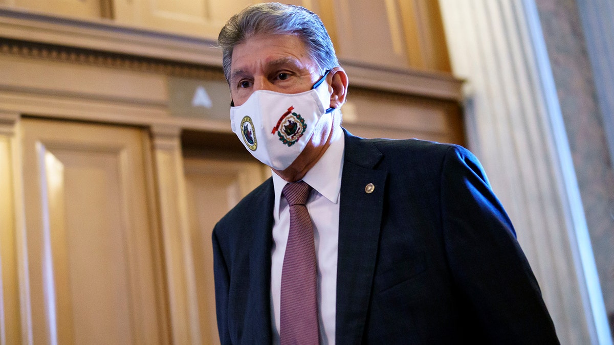 Sen. Joe Manchin, D-W.Va., a key moderate in the infrastructure agreement, arrives at the Senate in Washington, Tuesday, Aug. 10, 2021. (AP Photo/J. Scott Applewhite)