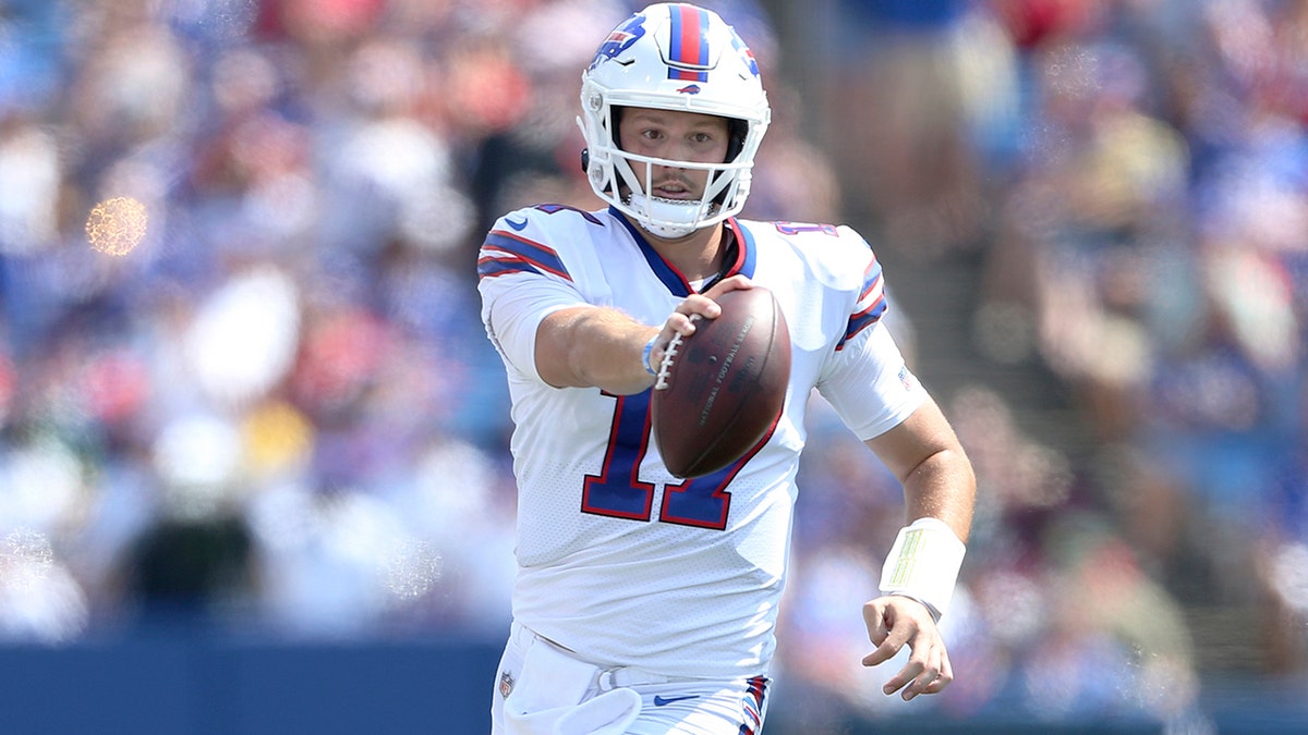 Buffalo Bills quarterback Josh Allen scrambles for a gain during the first half of a preseason NFL football game against the Green Bay Packers, Saturday, Aug. 28, 2021, in Orchard Park, N.Y. (AP Photo/Joshua Bessex)