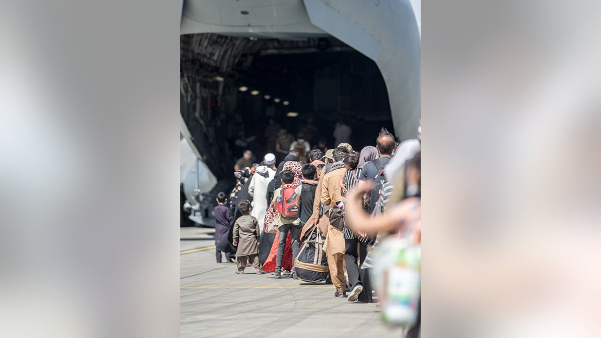 Families flee Kabul airport