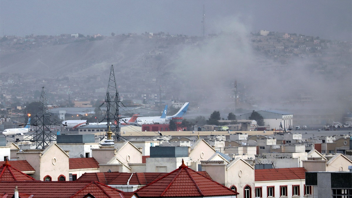 Smoke rises from explosion outside the airport in Kabul, Afghanistan, Thursday, Aug. 26, 2021.