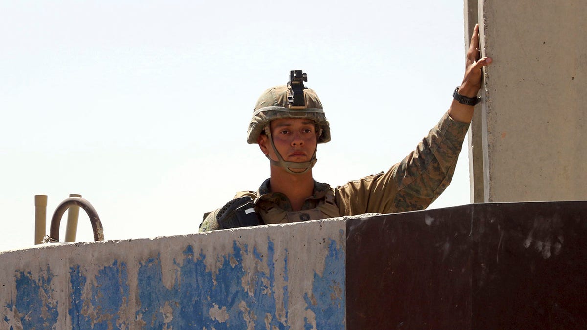 A U.S. soldier looks out