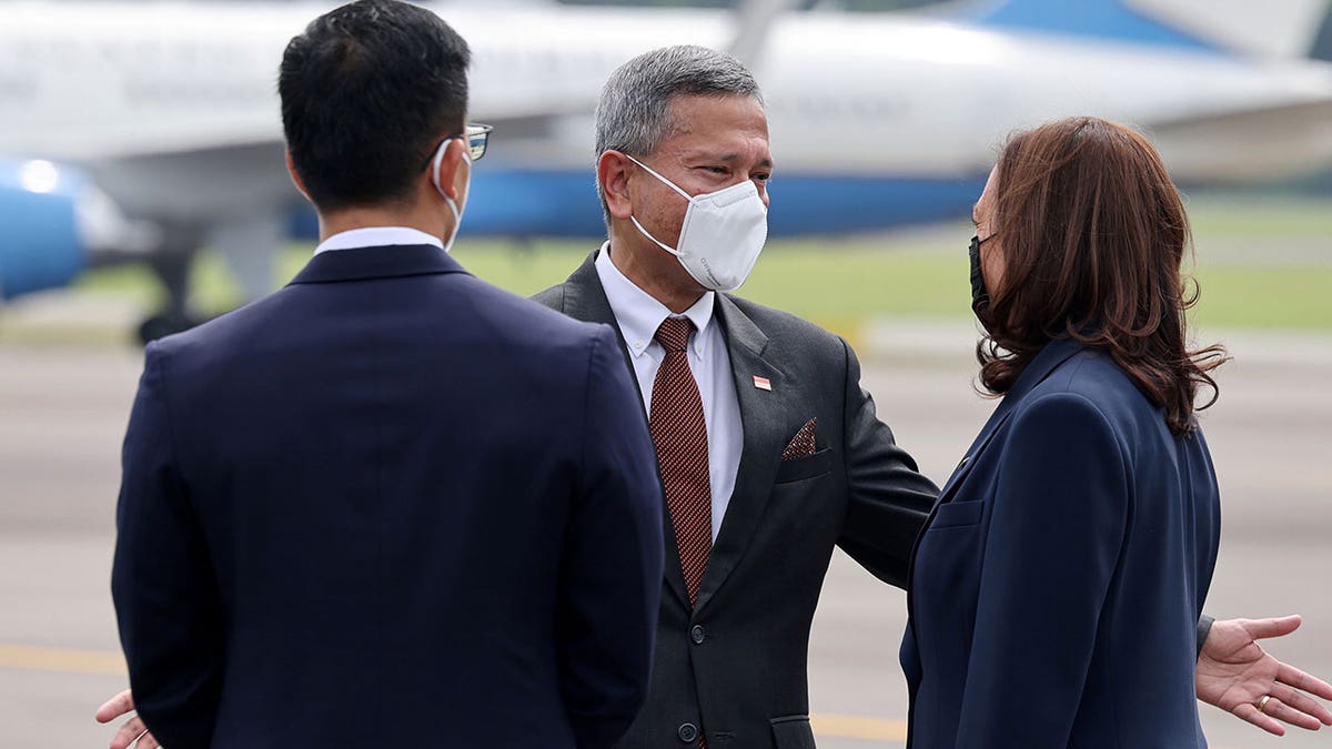 Vivian Balakrishnan, Singapore's foreign affairs minister, greets U.S. Vice President Kamala Harris upon her arrival in Singapore, Aug. 22, 2021. (Reuters)