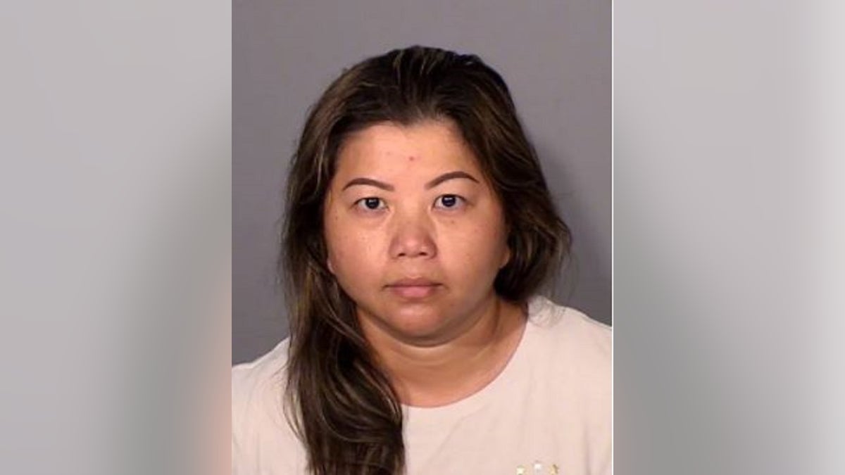 Karina See Her, 40, is charged with killing her ex-husband, whose body was discovered inthe backyard of their home, authorities said. 