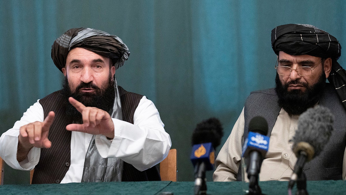 Members of the Taliban delegation: former western Herat Gov, Khairullah Khairkhwa and member of the negotiation team Suhail Shaheen attend a joint news conference in Moscow, Russia, March 19, 2021. Alexander Zemlianichenko/Pool via REUTERS