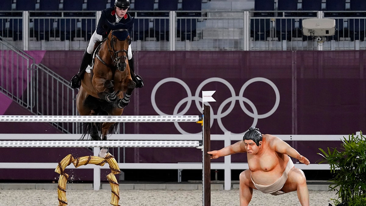 Britain's Harry Charles, riding Romeo 88, competes during the equestrian jumping individual qualifying at Equestrian Park in Tokyo at the 2020 Summer Olympics, Tuesday, Aug. 3, 2021, in Tokyo, Japan. (AP Photo/Carolyn Kaster)