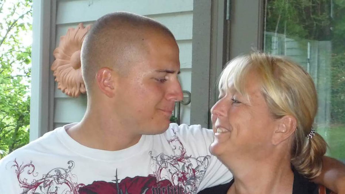 Lance Cpl. Eric L. Ward and his mother, Monica McNeal (Q13 FOX of Seattle)