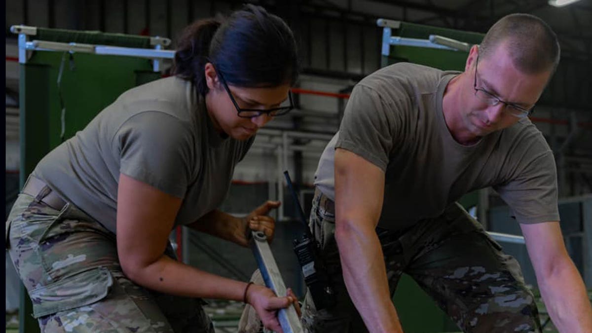 U.S. military personnel and volunteers make preparations for arriving evacuees at Ramstein Air Base in Germany. (Ramstein Air Base photo)