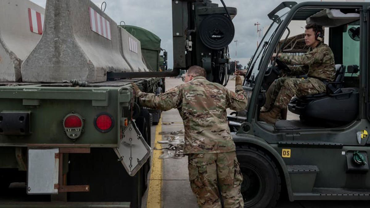 U.S. military personnel and volunteers make preparations for arriving evacuees at Ramstein Air Base in Germany. (Ramstein Air Base photo)