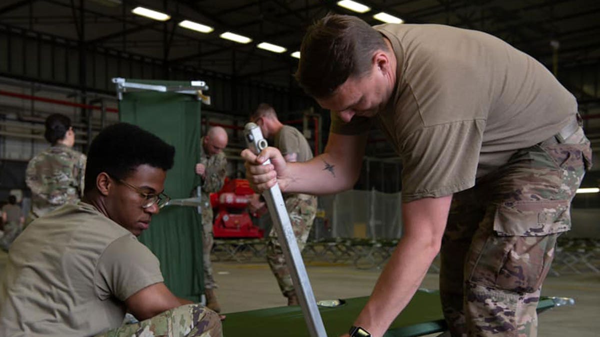 U.S. military personnel and volunteers make preparations for arriving evacuees at Ramstein Air Base in Germany. (Ramstein Air Base photo)