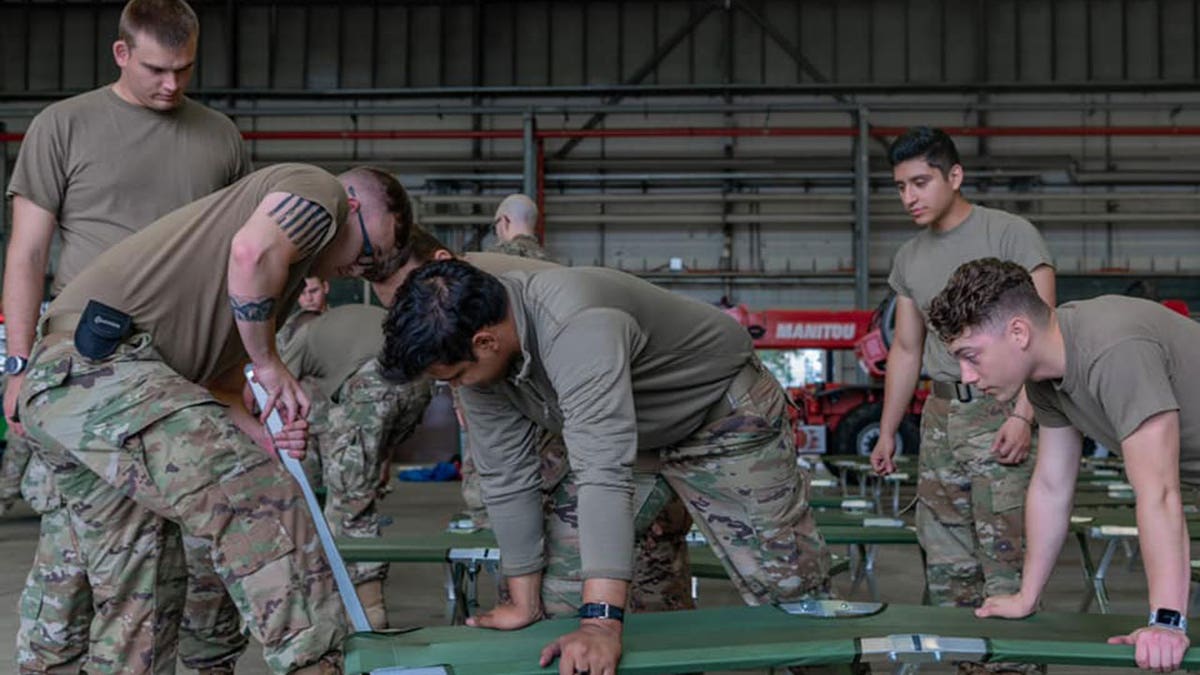 U.S. military personnel and volunteers make preparations for arriving evacuees at Ramstein Air Base in Germany. (Ramstein Air Base photo)